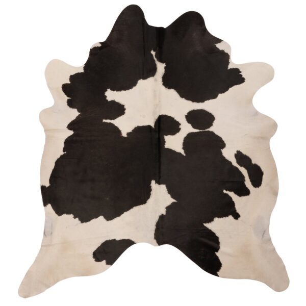 Un tapis en cuir de vache naturel noir et blanc sur un fond blanc. | 210x180cm.