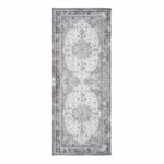 Un tapis couloir noir et blanc gris et blanc au motif fleuri mesurant 200x80 cm.