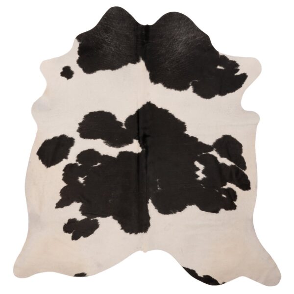 Un tapis Tapis peau de vache blanc avec les taches noires | 210x180 cm sur un fond blanc.