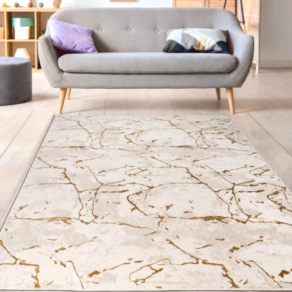 Tapis moderne blanc et or avec effet marbre