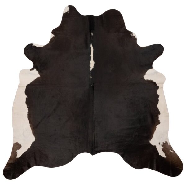 Un Tapis peau de vache unique | 210x180 cm en noir et blanc, sur un fond blanc.