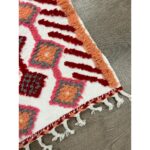 Un tapis berbère laine colorée | 115x69 cm en laine avec des franges.