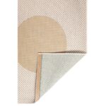 Un tapis beige avec un cercle.