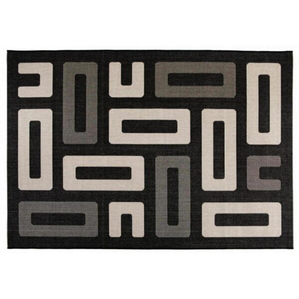 Un tapis noir et blanc aux formes géométriques.