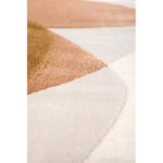 Un gros plan d'un tapis aux couleurs blanches et marron.