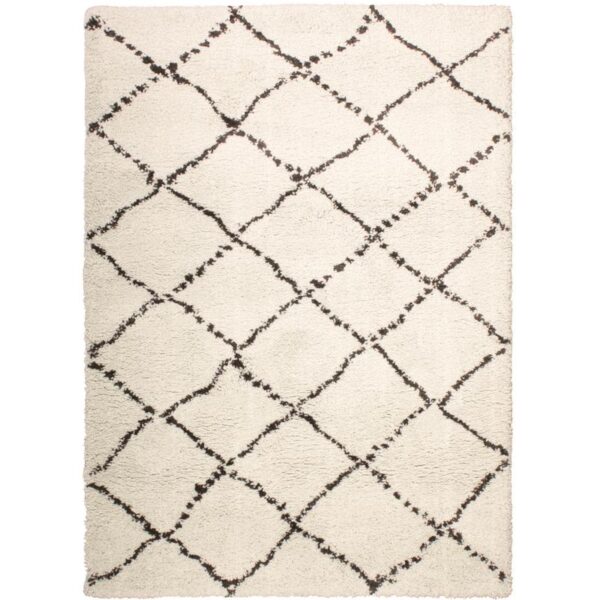 Un tapis blanc et noir avec un motif en losange.