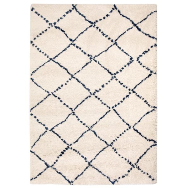 Un tapis blanc et bleu avec un motif en losange.