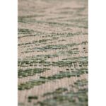 Une image en gros plan d’un tapis vert.