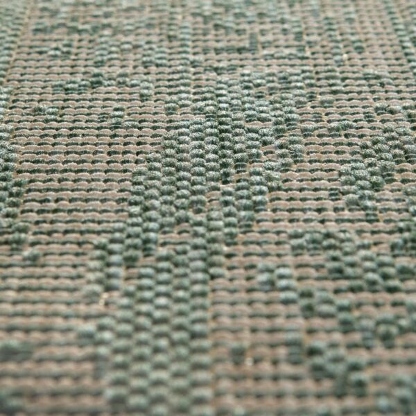 Un gros plan d’un tapis vert.