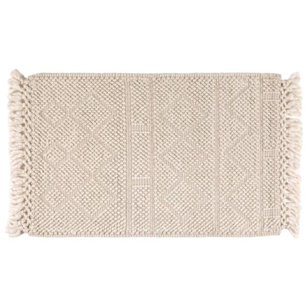 Tapis beige à motifs avec franges décoratives.