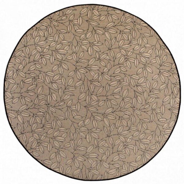Tapis rond beige à motifs feuilles pour décoration intérieure.