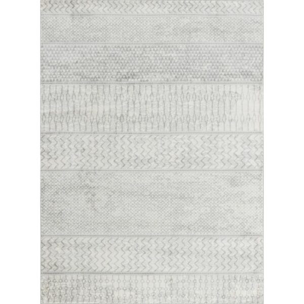 Tapis à motifs géométriques gris et blancs.