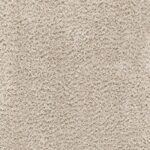 Texture de tapis beige en gros plan.