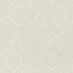 Texture tissu beige avec motifs géométriques en relief.