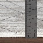 Règle métallique mesure épaisseur tapis.