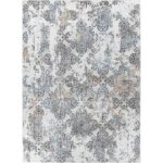 Tapis à motifs damassés bleus et gris.