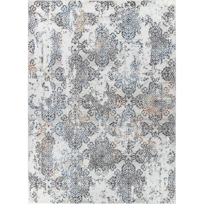 Tapis à motifs damassés bleus et gris.