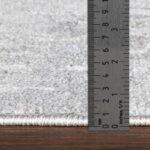 Règle mesurant épaisseur de tapis.