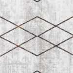 Tapis moderne aux motifs géométriques.