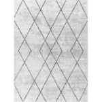 Tapis gris motifs géométriques losanges.