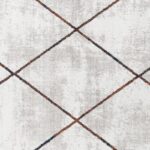 Tapis texturé avec motif géométrique en losanges.