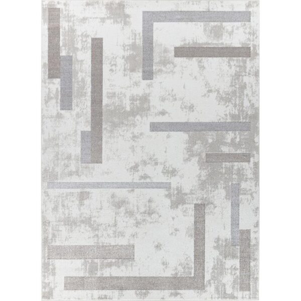 Tapis moderne gris avec motifs géométriques.