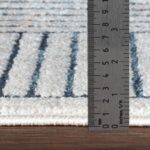 Règle mesurant épaisseur de tapis.