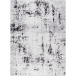 Tapis à motif abstrait en nuances de gris.