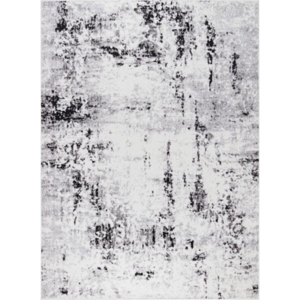 Tapis à motif abstrait en nuances de gris.