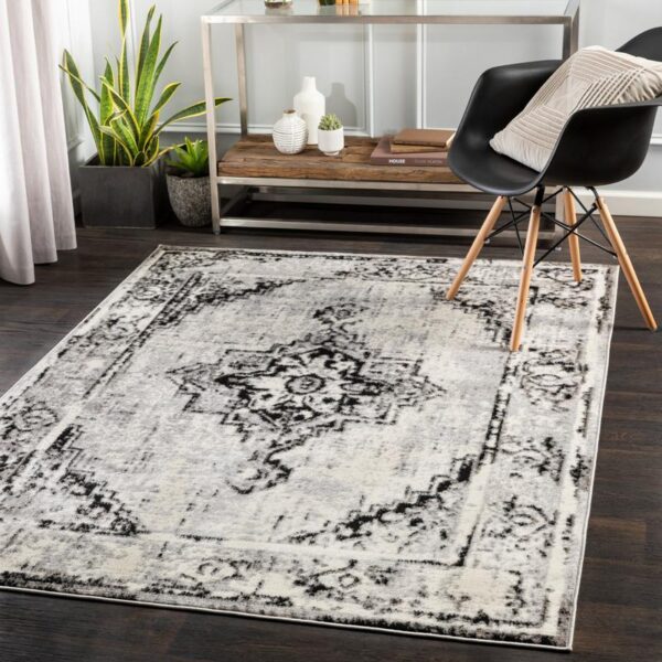 Tapis design gris et blanc dans un salon moderne.