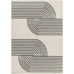 Tapis moderne à motifs géométriques noirs et blancs.