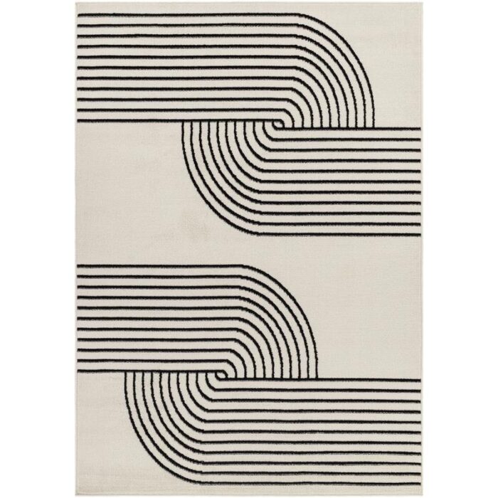 Tapis moderne à motifs géométriques noirs et blancs.