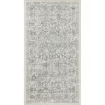 Tapis vintage gris à motifs.