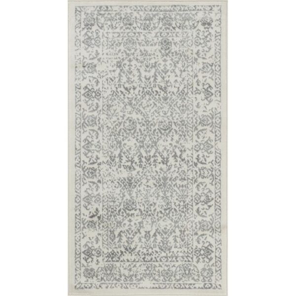 Tapis vintage gris à motifs.