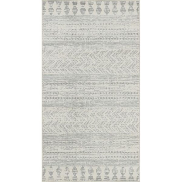 Tapis motifs tribaux gris et blancs.