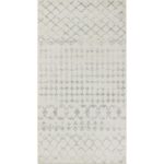 Tapis à motifs géométriques gris et blanc.