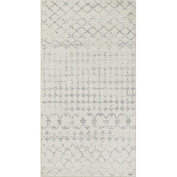 Tapis à motifs géométriques gris et blanc.