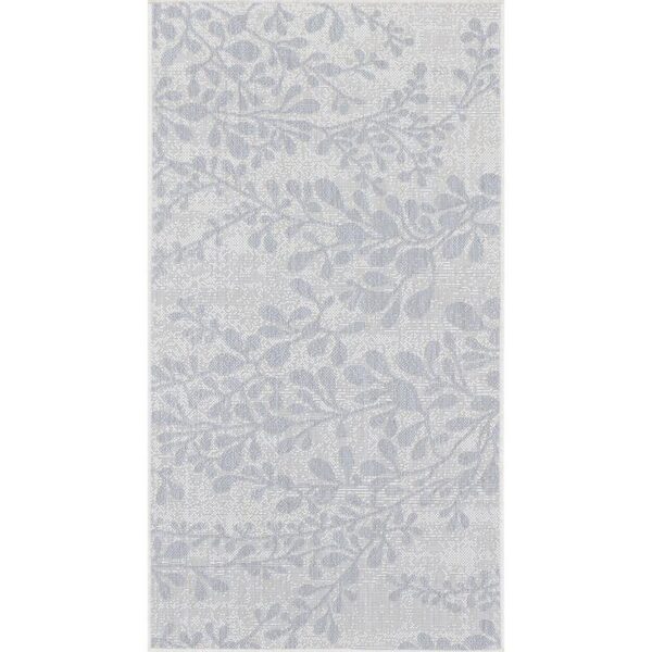 Tapis à motif floral en nuances de gris.