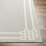 Tapis moderne gris design géométrique sur parquet