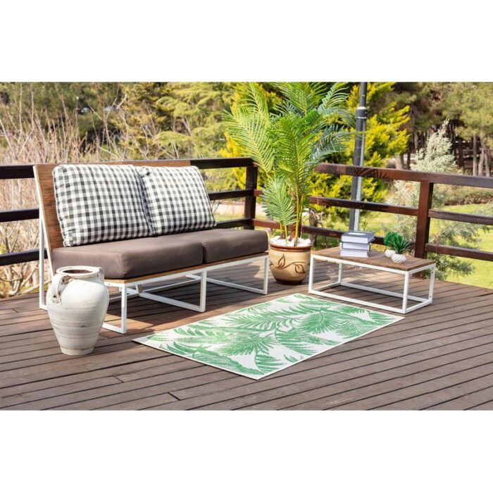 Salon de jardin moderne sur terrasse en bois.