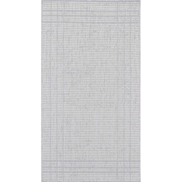 Tapis texturé gris pour intérieur moderne.