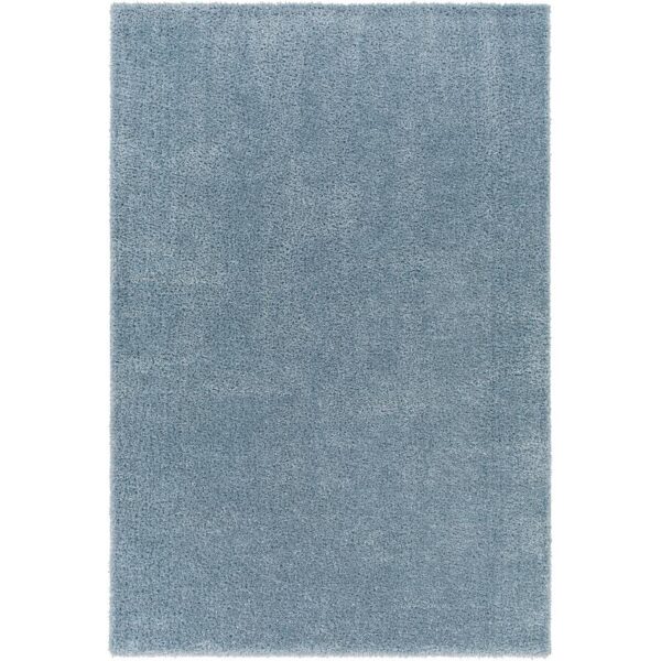 Tapis bleu doux et moelleux en gros plan.