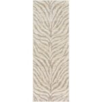 Tapis à motifs de feuilles zébrées en beige.