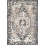 Tapis vintage gris et beige avec motifs.