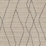 Texture de tapis beige à motifs ondulés.