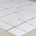 Tapis blanc géométrique moderne.
