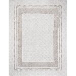 Tapis motif géométrique blanc et beige.