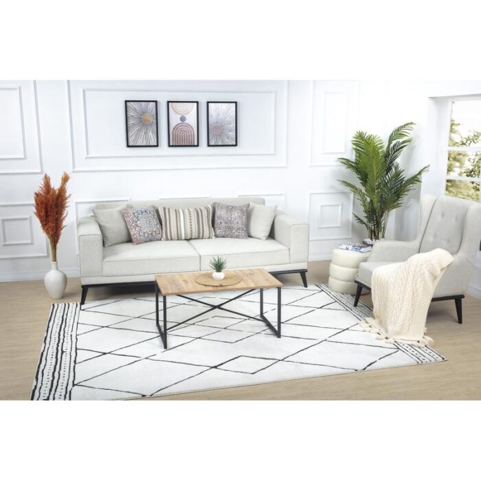 Salon moderne avec canapé et décoration épurée.