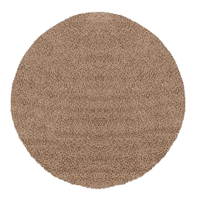 Tapis rond marron texturé en fibres.