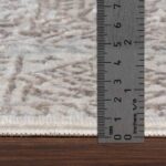 Règle mesurant l'épaisseur d'un tapis.